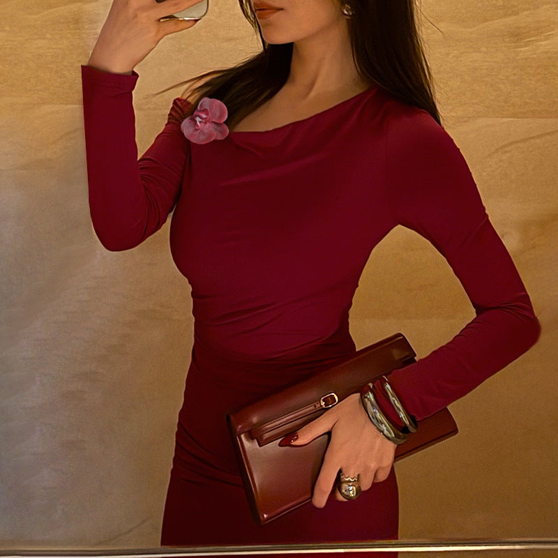 Ladies elegant long-sleeved evening dress with asymmetric neckline and figure-flattering design