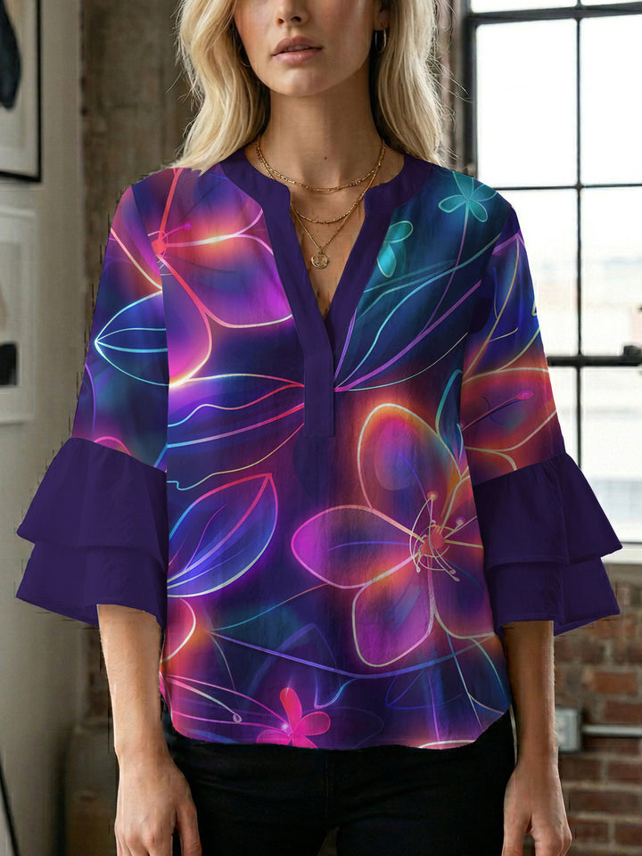 Women’s blouse with voluminous ruffled sleeves and floral pattern Lune London