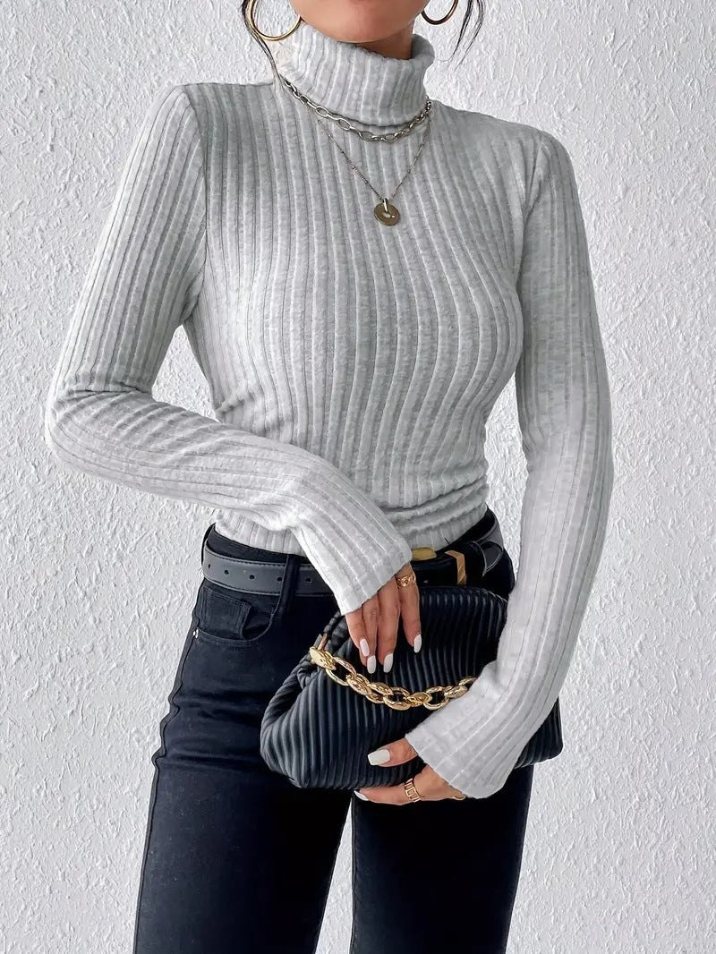 Ladies elegant ribbed knit top with high collar and longer cut Lune London
