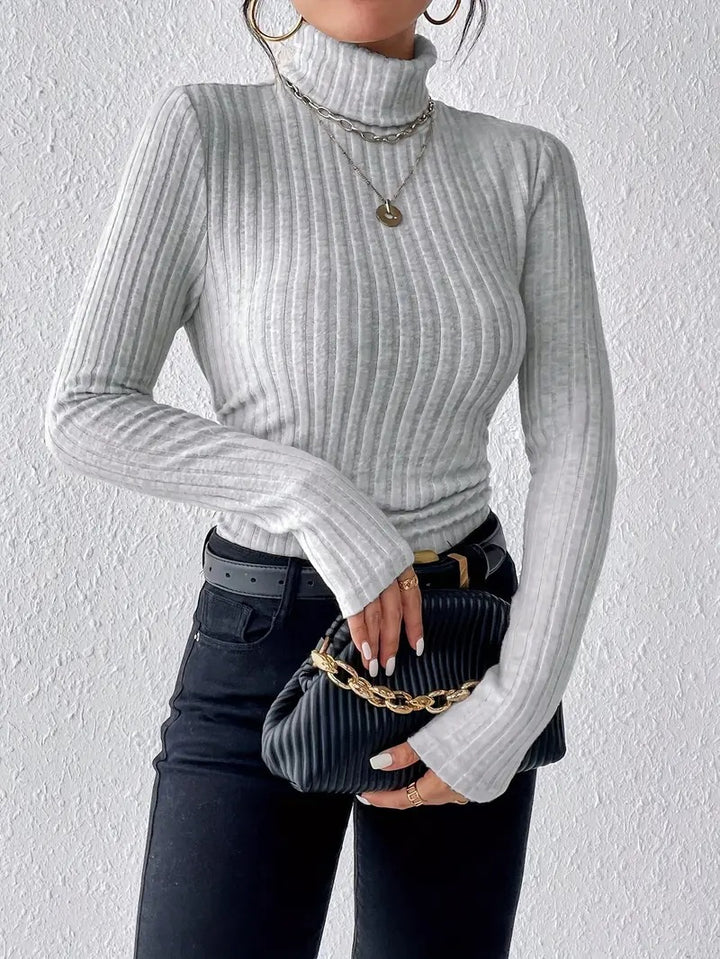 Ladies elegant ribbed knit top with high collar and longer cut Lune London