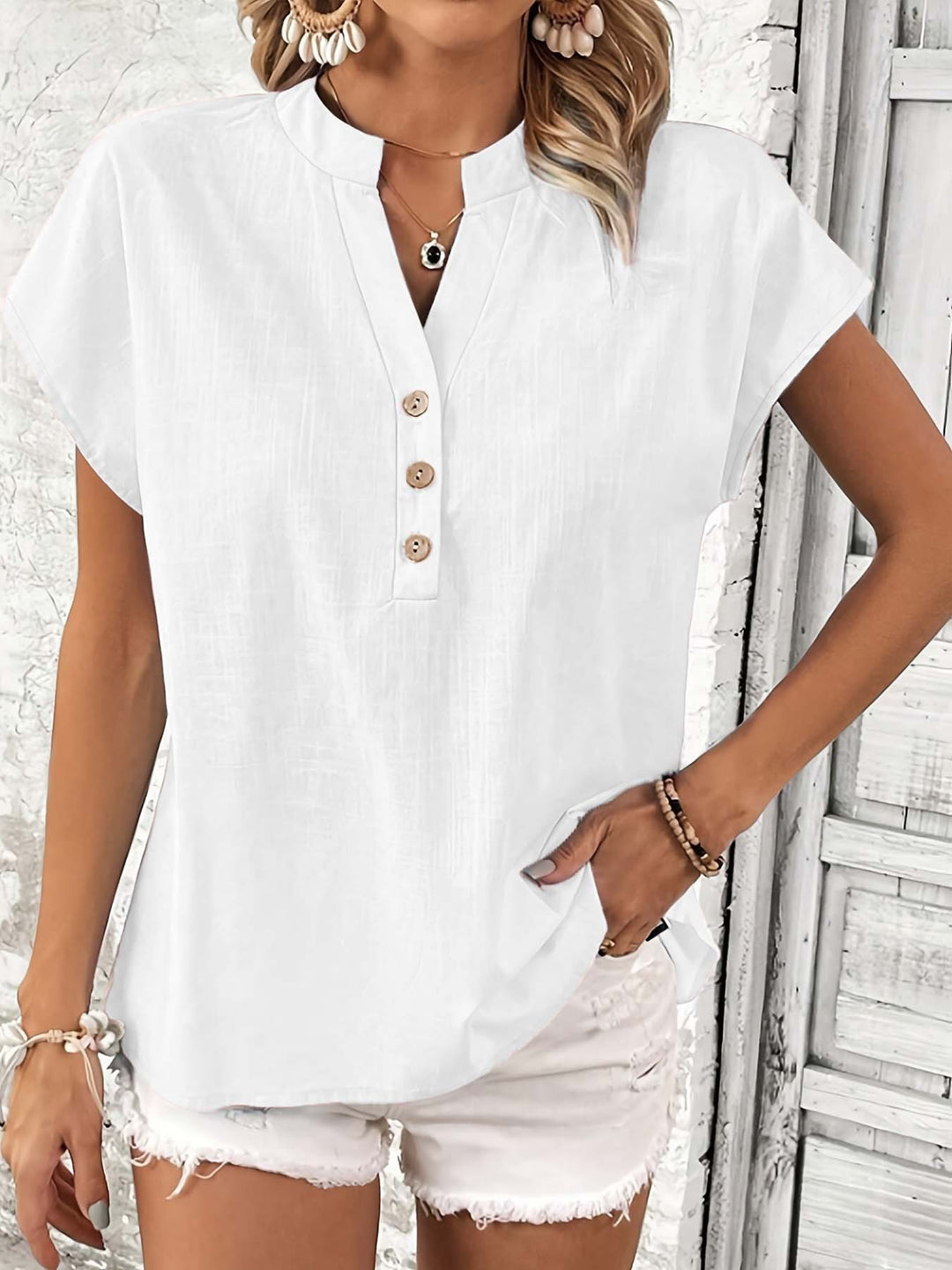 Women highly stylish short sleeve t-shirt with button details and trendy high collar Lune London