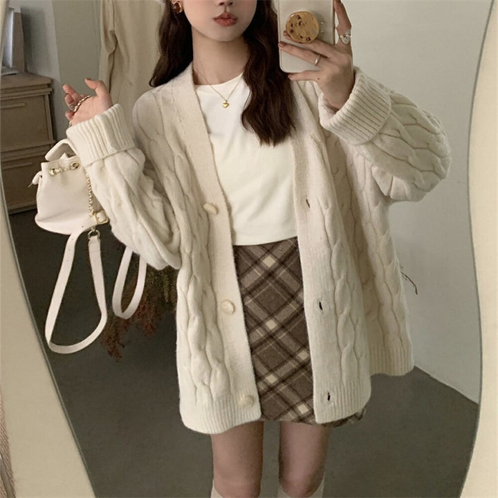 Ladies large knit cardigan with an elegant cable pattern and comfortable button details Lune London