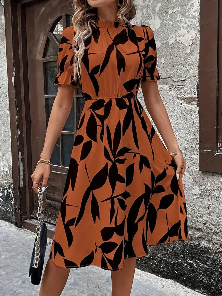 Robe midi élégante pour femmes avec motif de plantes stylé et taille élastique Chic & Stil