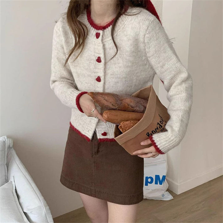 Ladies cozy knit vest with heart-shaped buttons and refined sleeve design Lune London