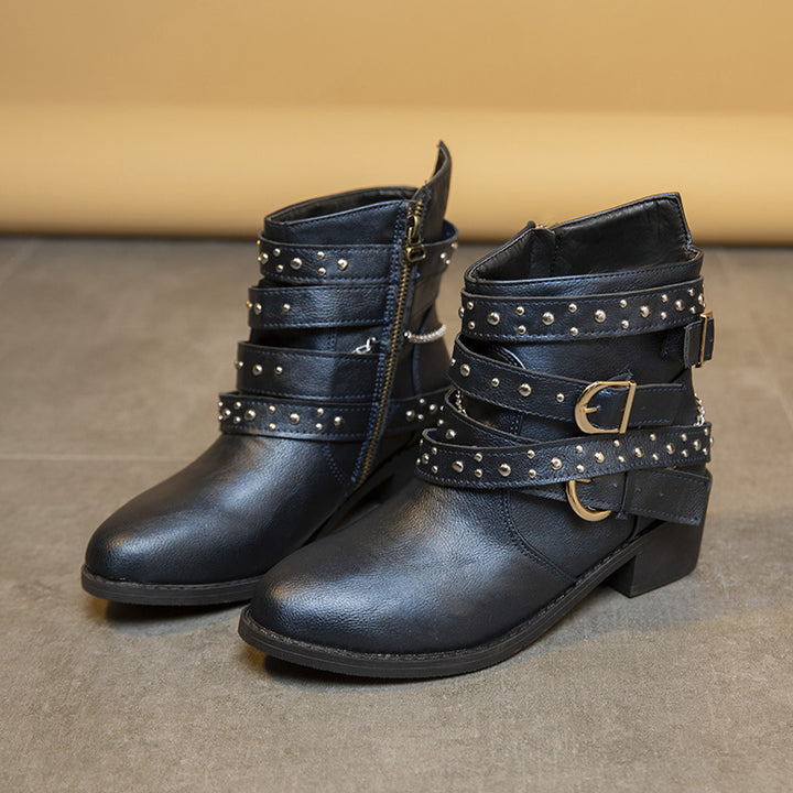 Trendy women's ankle boots with decorative straps and chain elements Lune London
