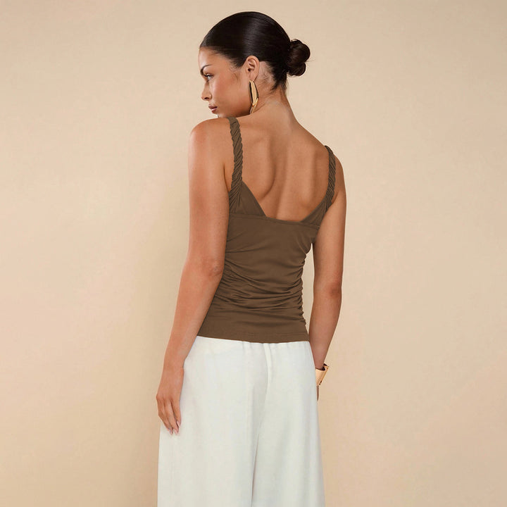 Elegant top for women with spaghetti straps featuring sophisticated bow details and a chic & stylish elastic waist.