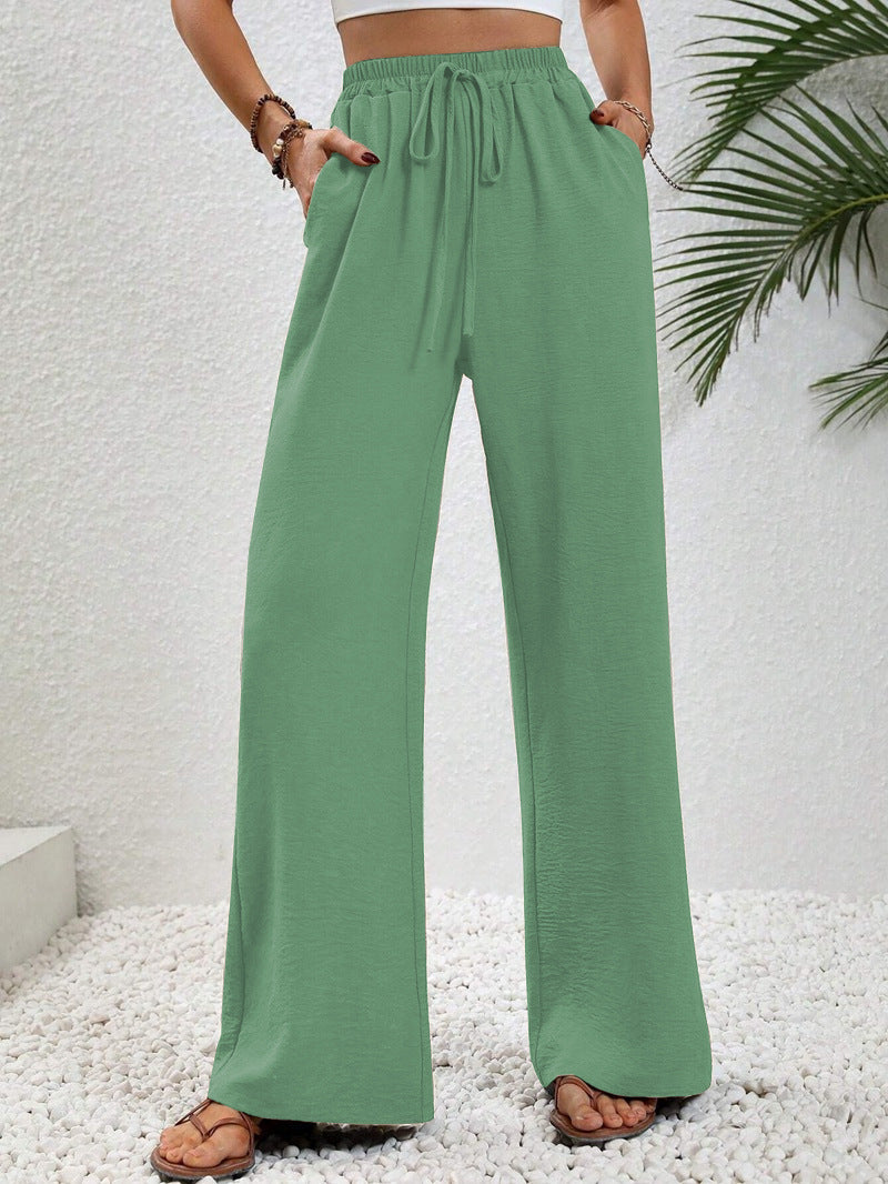 Pantalons larges d'été pour femmes avec taille élastique et poches latérales pratiques Chic & Stil