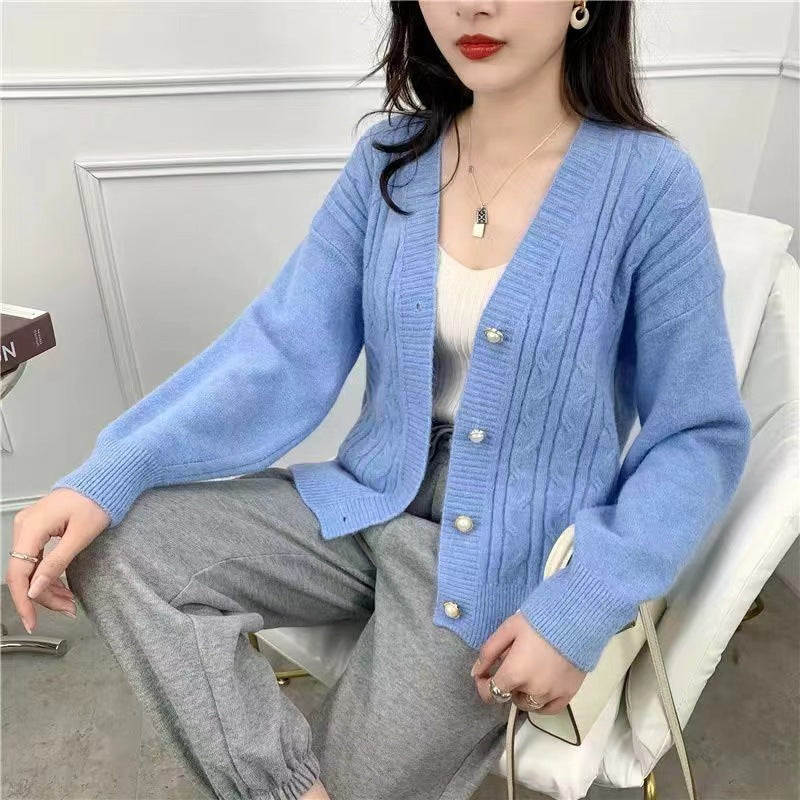 Knitted jacket for women with an elegant braid pattern and high-quality button details Lune London
