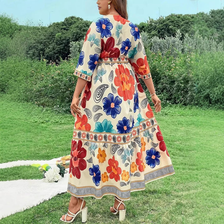 Women's maxi dress with colorful floral design and waist belt Lune London