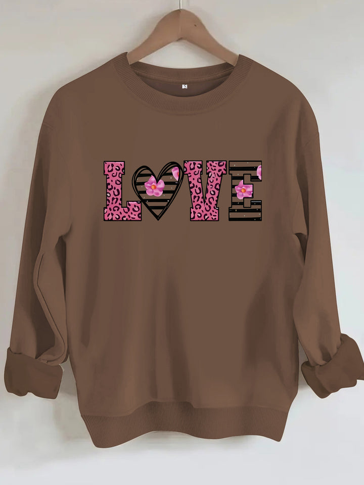 Sweatshirt femme avec design moderne de cœur léopard et coupe confortable Chic & Stil
