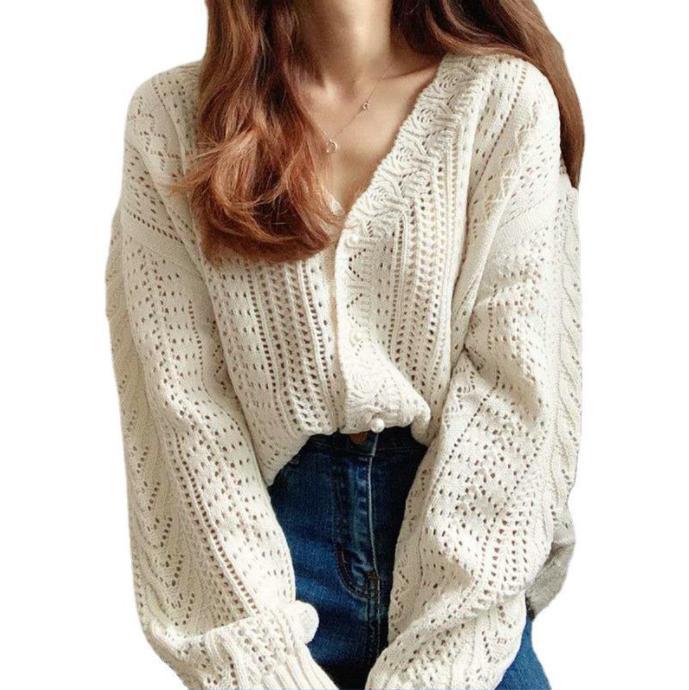 Thick knitted sweater for women with a trendy V-neck and chic button details
