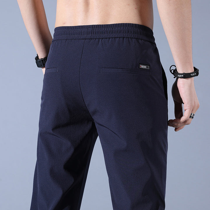 Sports jogger pants for men with elastic waist and practical zip pockets Lune London