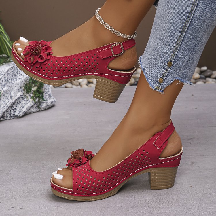 Women's clogs with a decorative floral detail and a perforated surface Lune London