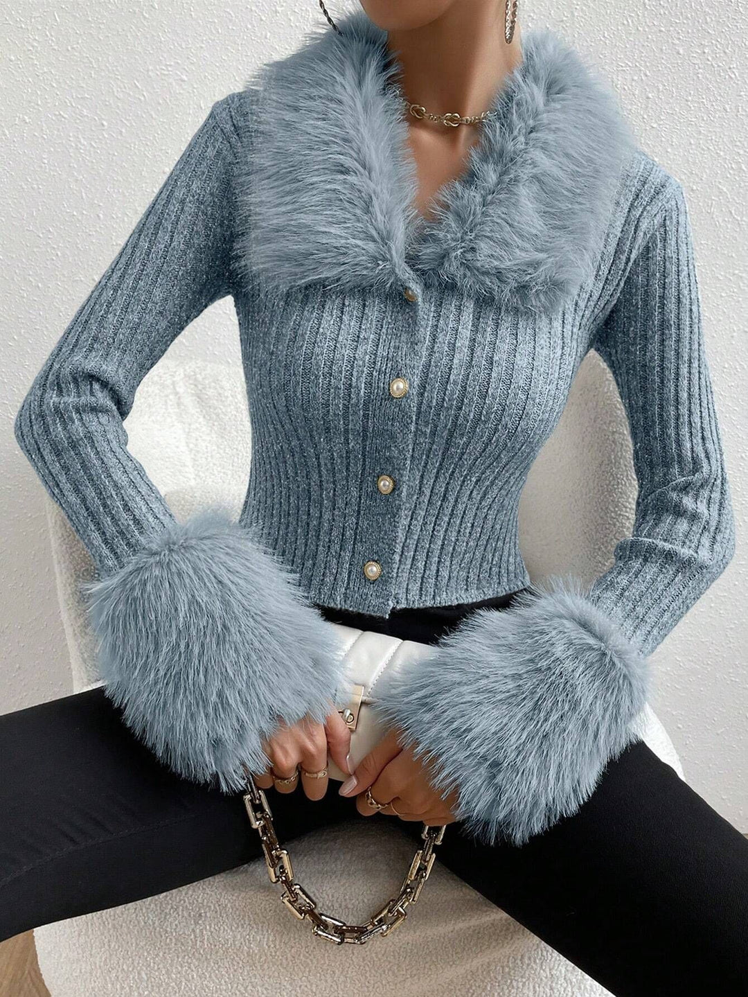 Trendy knitted sweater for women with a fluffy collar and chic and stylish sleeve finishes