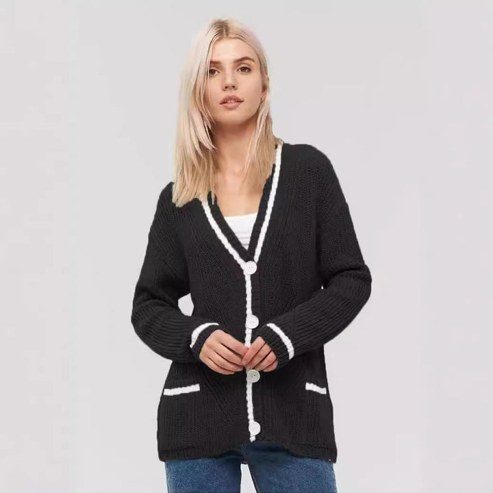 Ladies chunky knitted jacket with practical flap pockets and contrasting details Lune London