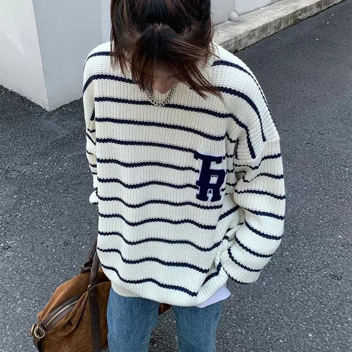 Casual oversized knit sweater for women with broken stripes and a chest pocket Lune London