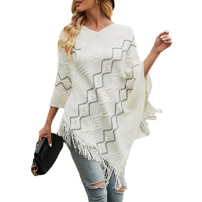 Lune London Elegant poncho for women with a striking textured pattern and decorative fringes