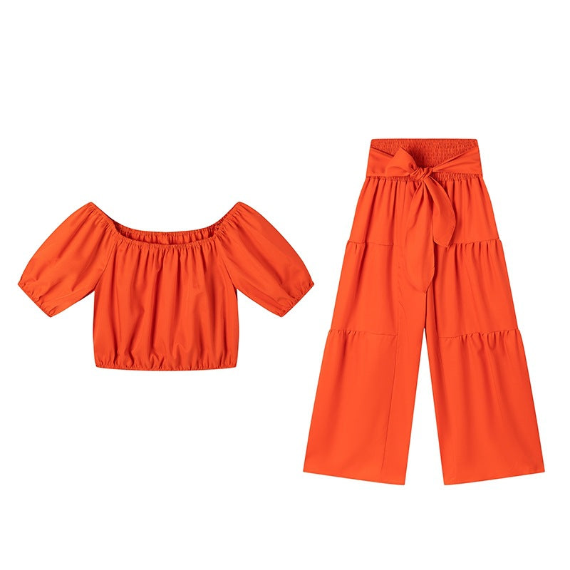 Woman Deep V-Neck Crop Top and High-Waisted Palazzo Pants Lune London