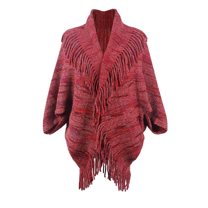 Ladies knitted poncho with luxurious fringes and a modern design Lune London