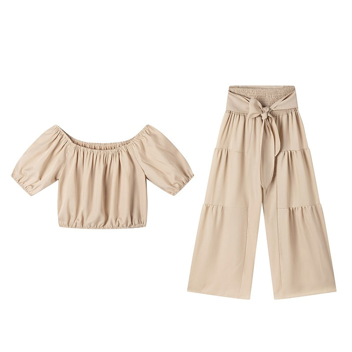 Woman Deep V-Neck Crop Top and High-Waisted Palazzo Pants Lune London