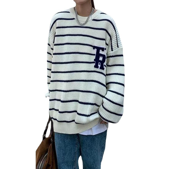 Casual oversized knit sweater for women with broken stripes and a chest pocket Lune London