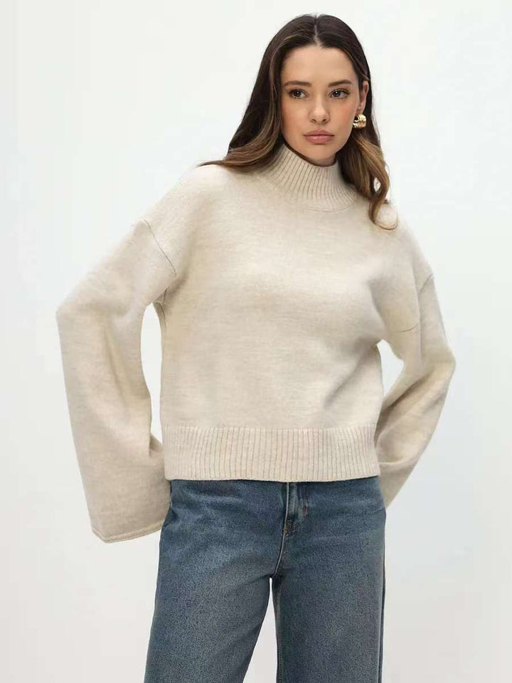 Trendy oversized knit sweater for women with wide sleeves and a high collar Lune London