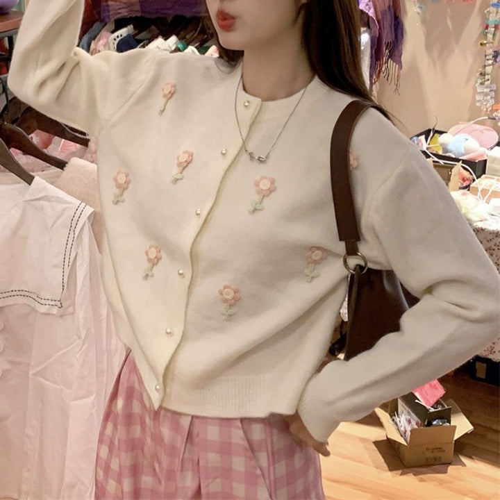 Knit jacket for women with elaborate floral appliqués and elegant pearl buttons Lune London