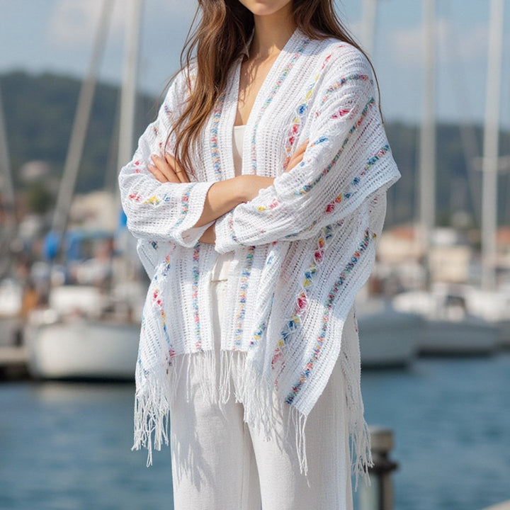 Ladies casual poncho with fringe details and a chic and stylish colorful pattern