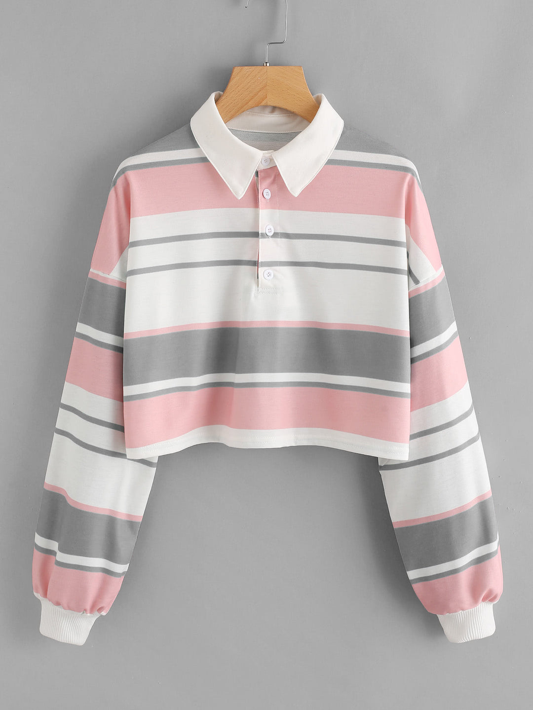 Women's polo shirt in a casual crop design with a stylish color block pattern Chic & Stil