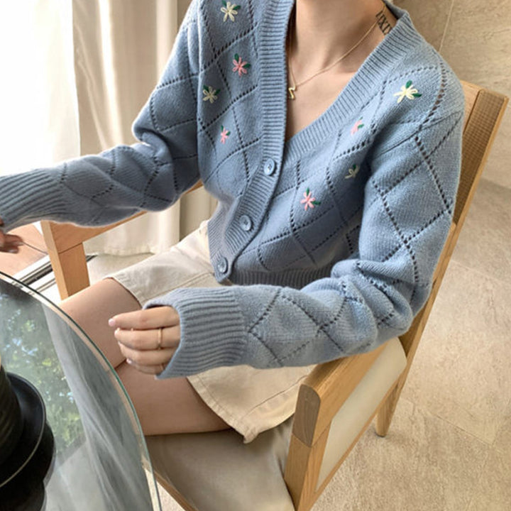 Ladies playful cardigan with diamond floral pattern and button detail Lune London