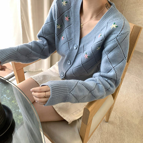 Ladies playful cardigan with diamond floral pattern and button detail Lune London