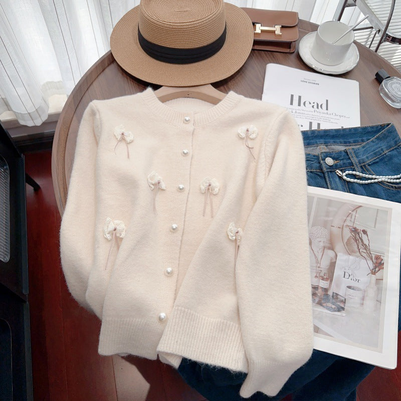 Knit jacket for women with feminine appliques and chic button details