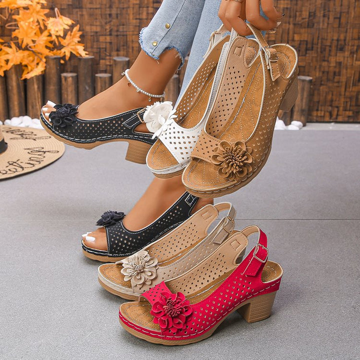Women's clogs with a decorative floral detail and a perforated surface Lune London