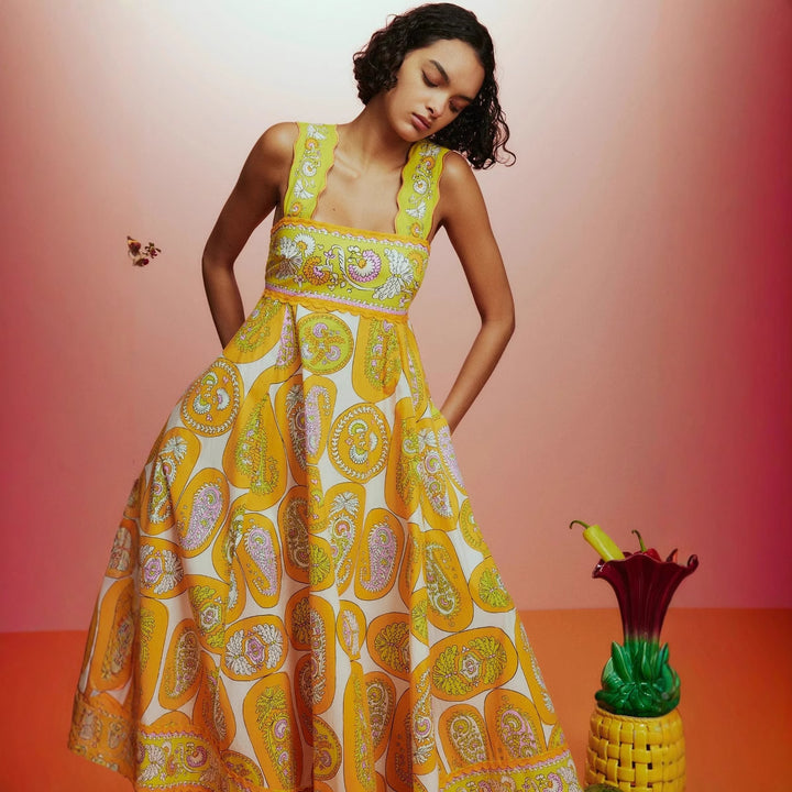 Women's maxi dress with playful paisley design and narrow waist belt Lune London