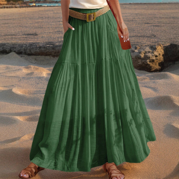 Maxi flared skirt for women with elegant pleated draping and practical pockets Lune London