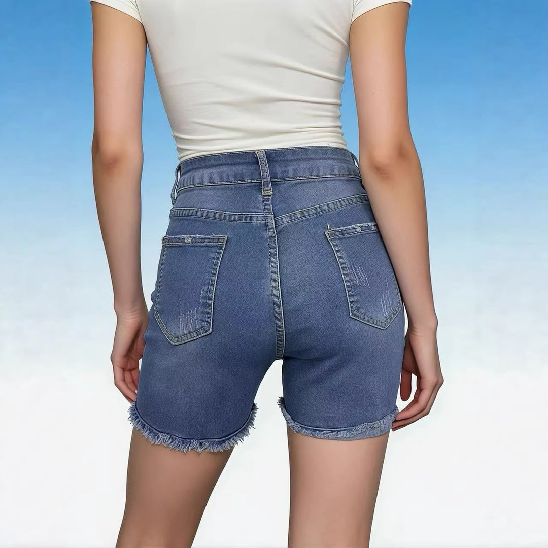 Women's casual high-waist denim shorts with fringe and trendy distressed details Lune London