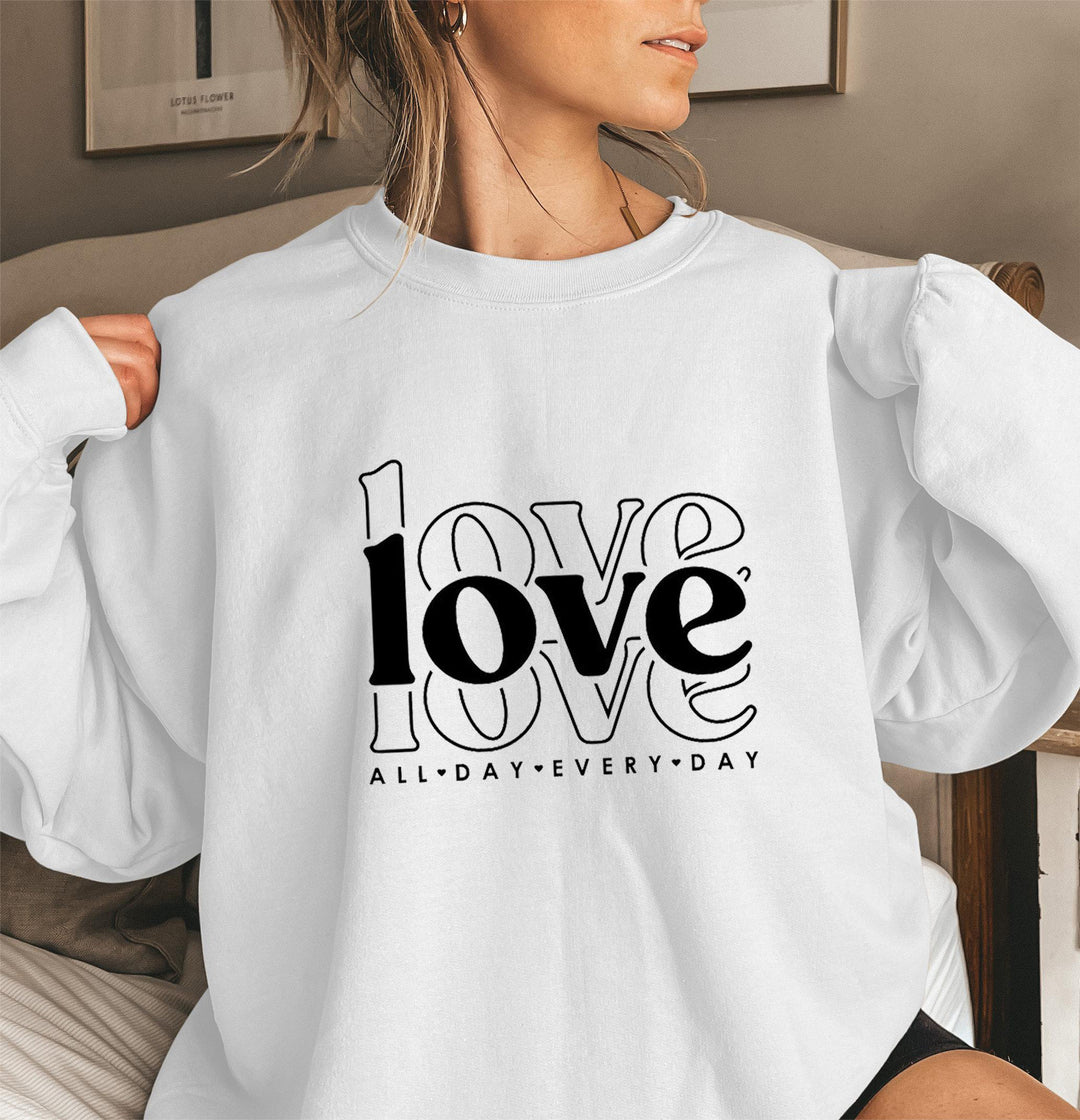 Sweat-shirt pour femmes avec des manches volumineuses et imprimé moderne "love" Chic & Stil