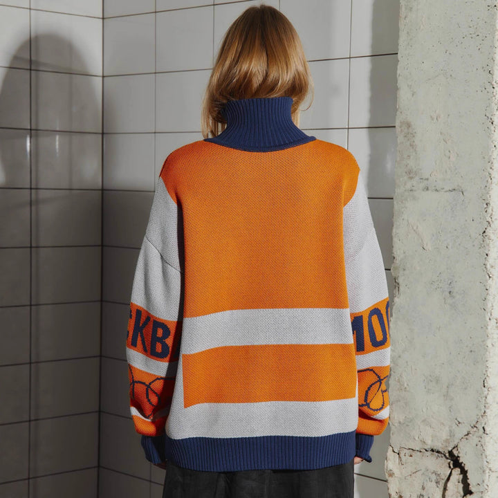 Pull décontracté pour femmes avec un design graphique accrocheur et un ourlet profond Chic & Stil