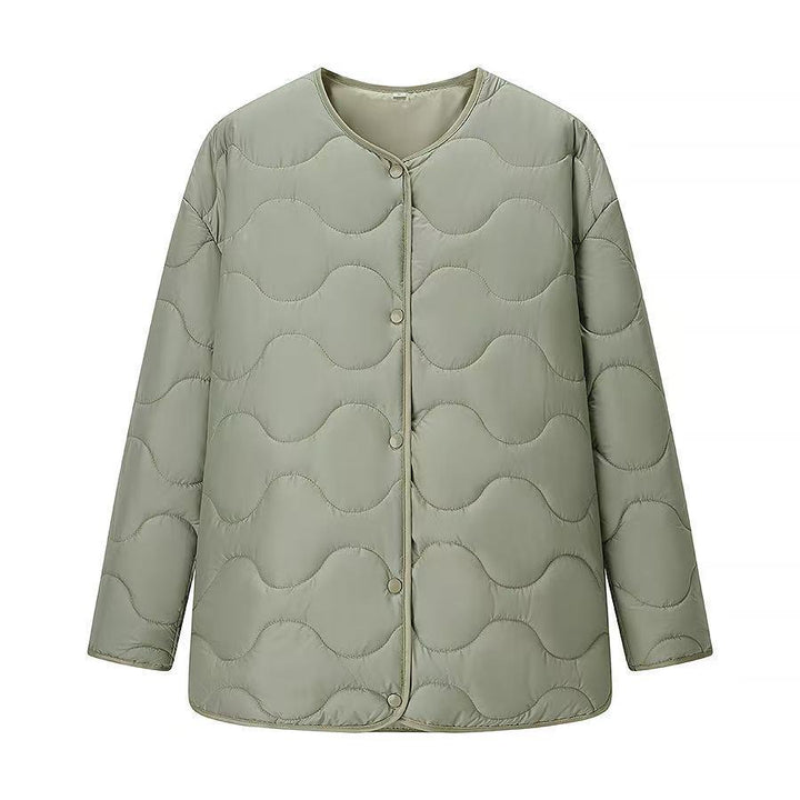 Veste de transition matelassée pour femmes avec une structure ondulée innovante et une fermeture à boutons pratique Chic & Stil
