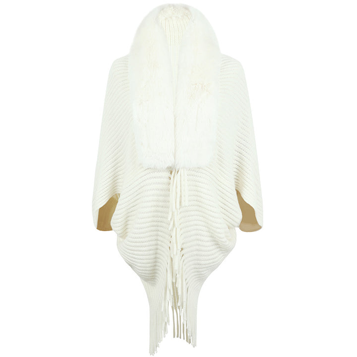 Luxurious knitted poncho for women with elegant faux fur collar and fringes Lune London