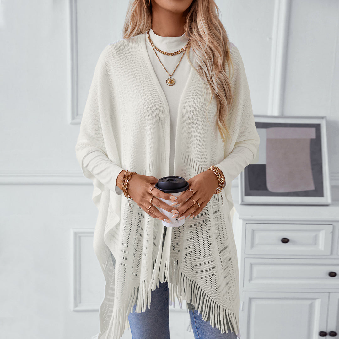 Elegant knitted poncho for women with fringe details and a distinctive pattern Lune London