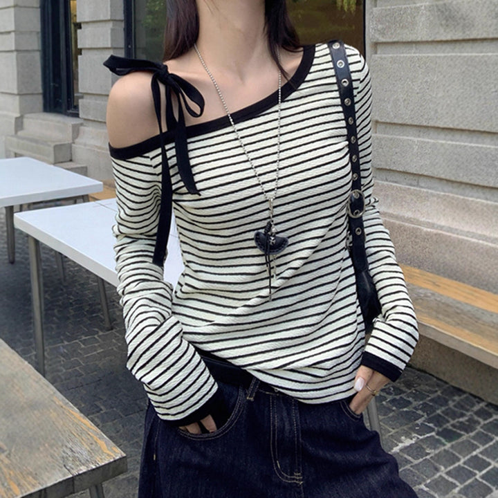 Women's off-shoulder long-sleeve shirt with striped design and decorative bow details Chic & Stil