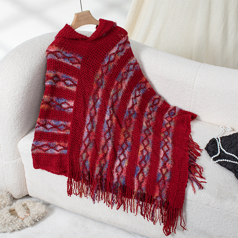 Ladies knitted poncho with hood and fringe design Lune London