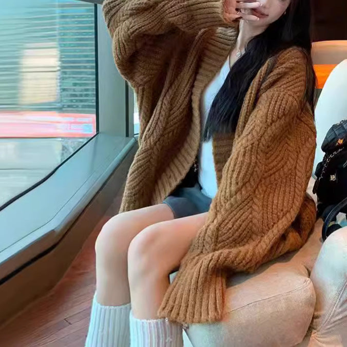 Ladies oversized knit cardigan with oversized sleeves and large button details Lune London