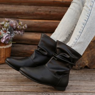 Fashionable women's ankle boots with an elegant ruffle design and a soft upper material Lune London