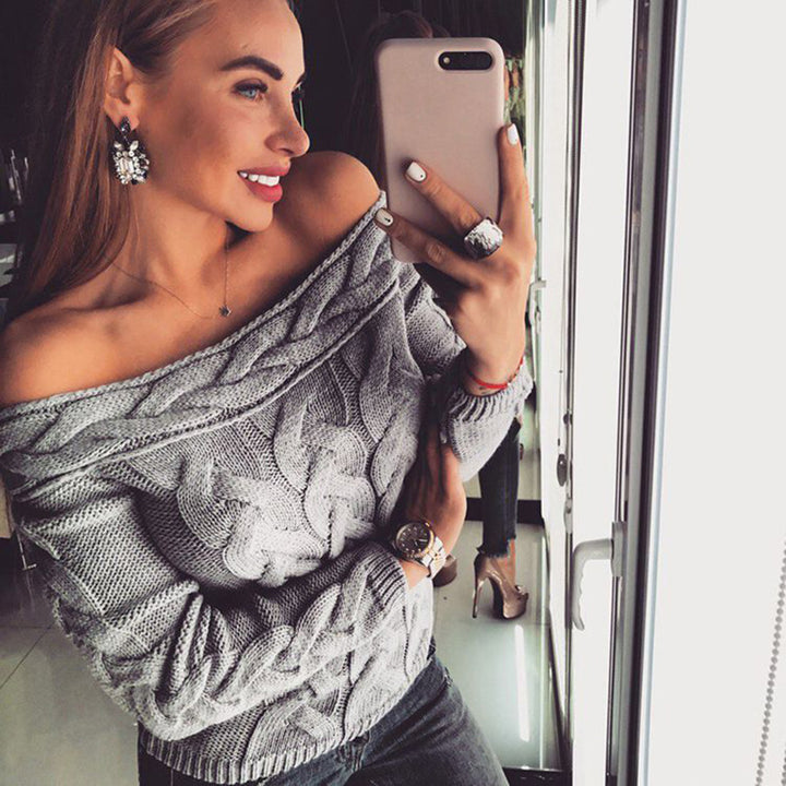 Women's knit sweater with modern cable pattern and chic décolleté silhouette