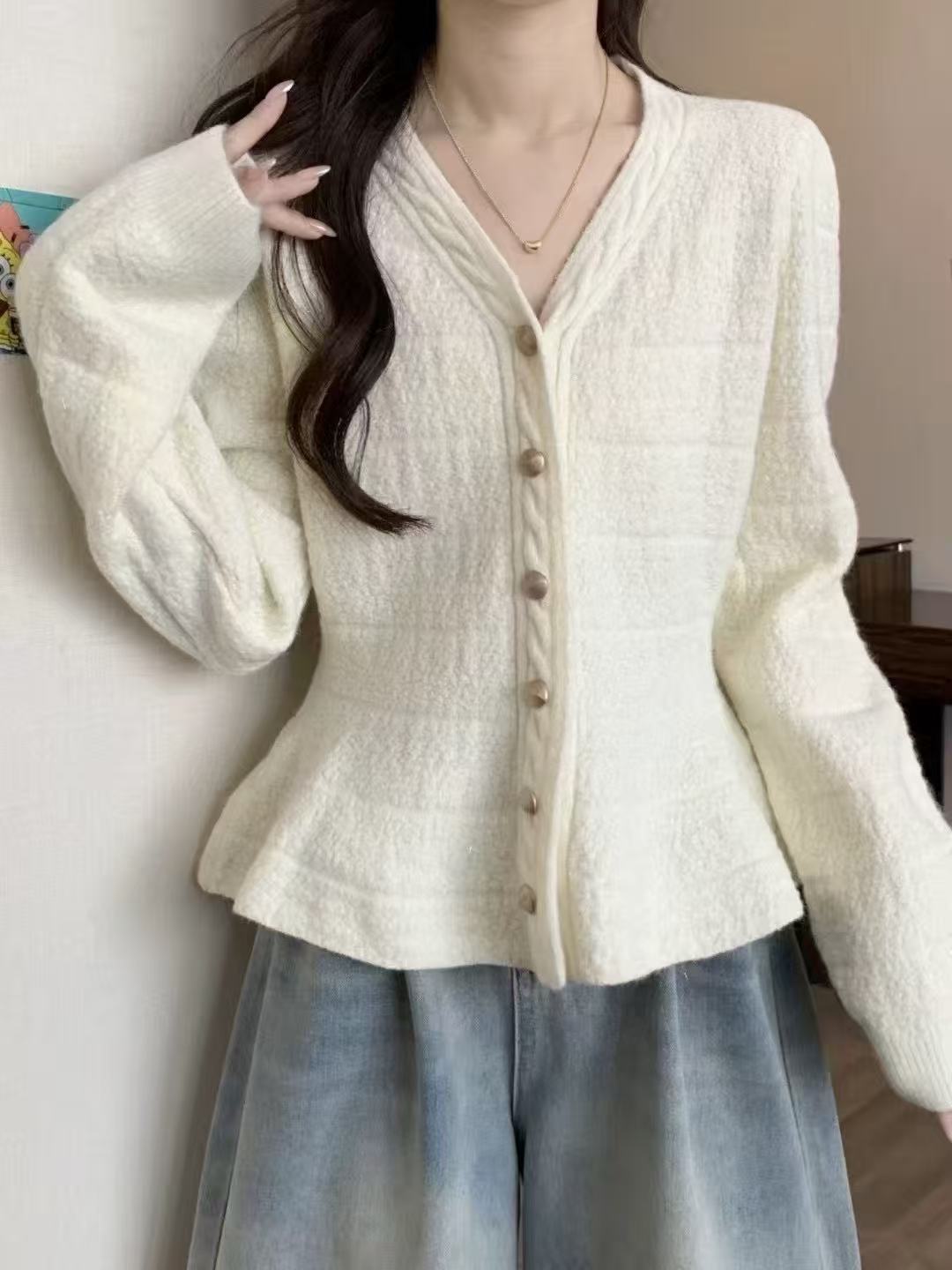 Ladies elegant cardigan with textured design and feminine puff sleeves Lune London