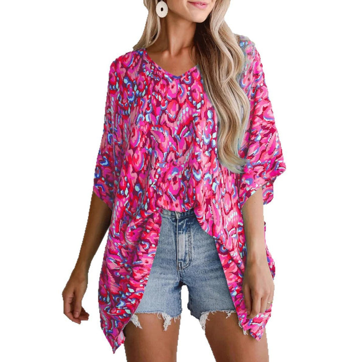 Casual beach blouse for women with an asymmetrical cut and colorful pattern Lune London