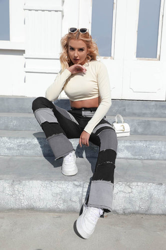 Women's bootcut jeans with a modern patchwork design and casual fringes Lune London