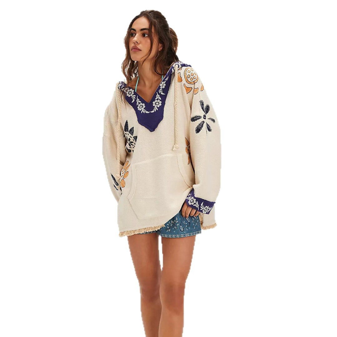 Hooded poncho for women with colorful embroidery and fringed edges Lune London
